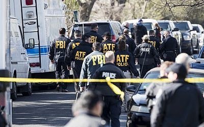 Authorities work on the scene after multiple explosions in Austin on Monday, March 12, 2018. (Ricardo B. Brazziell/Austin American-Statesman via AP)