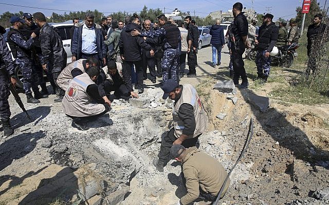 Hamas personnel inspect the site of an explosion that occurred as the convoy of Palestinian Authority Prime Minister Rami Hamdallah entered Gaza through the Erez crossing with Israel, on the main road in Beit Hanoun, Gaza Strip, on March 13, 2018. (AP Photo/Adel Hana) Hamas personnel inspect the site of an explosion that occurred as the convoy of Palestinian Authority Prime Minister Rami Hamdallah entered Gaza through the Erez crossing with Israel, on the main road in Beit Hanoun, Gaza Strip, on March 13, 2018. (AP Photo/Adel Hana)