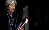 Britain's Prime Minister Theresa May leaves 10 Downing Street to attend the weekly Prime Minister's Questions session, in Parliament in London, Wednesday, March 14, 2018. (AP Photo/Frank Augstein)