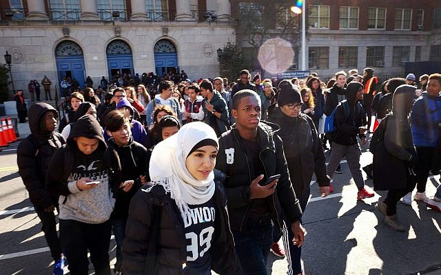 Hundreds of students walk out of Midwood High School as part of a nationwide protest against gun violence March 14, 2018, in the Brooklyn borough of New York. (AP Photo/Mark Lennihan) Hundreds of students walk out of Midwood High School as part of a nationwide protest against gun violence March 14, 2018, in the Brooklyn borough of New York. (AP Photo/Mark Lennihan)