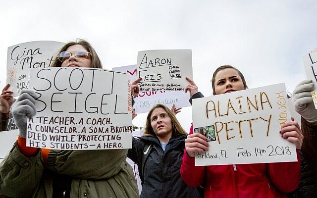 Students participate in a walkout to protest gun violence at Lapeer High School, March 14, 2018 in Lapeer, Michigan. (Bronte Wittpenn/The Flint Journal-MLive.com via AP) Students participate in a walkout to protest gun violence at Lapeer High School, March 14, 2018 in Lapeer, Michigan. (Bronte Wittpenn/The Flint Journal-MLive.com via AP)