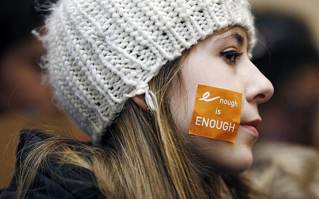 Helena Cameron, 15, of Medford, Mass., listens to speeches during a rally in St. Paul's Cathedral in Boston before a student march to the Statehouse on March 14, 2018. (AP Photo/Michael Dwyer) Helena Cameron, 15, of Medford, Mass., listens to speeches during a rally in St. Paul's Cathedral in Boston before a student march to the Statehouse on March 14, 2018. (AP Photo/Michael Dwyer)