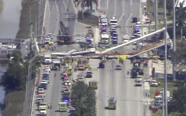In this frame from video, emergency personnel work at the scene of a collapsed bridge in the Miami area, March 15, 2018. (WPLG-TV via AP) In this frame from video, emergency personnel work at the scene of a collapsed bridge in the Miami area, March 15, 2018. (WPLG-TV via AP)