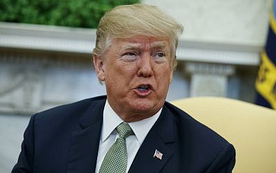 In this March 15, 2018, photo, President Donald Trump talks with reporters during a meeting in the Oval Office of the White House in Washington.  (AP Photo/Evan Vucci)