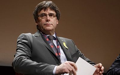 In this file photo from March 18, 2018, Catalan's fugitive ex-president Carles Puigdemont, takes part in a panel titled "Self-Determination," at the International Film Festival and Forum on Human Rights, in Geneva, Switzerland. (Salvatore Di Nolfi/Keystone via AP, file)