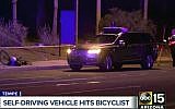 This March 19, 2018, still image taken from video provided by ABC-15, shows investigators at the scene of a fatal accident involving a self-driving Uber car on the street in Tempe, Arizona. (ABC-15.com via AP)