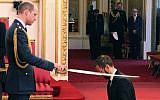Former Beatle Ringo Starr, is made a knight by Britain's Prince William at Buckingham Palace during an Investiture ceremony in London Tuesday March 20, 2018. (Yui Mok/PA via AP)