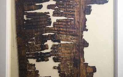 A fragile fragment of an enigmatic Dead Sea Scroll is on public display at the Israel Museum for the first time since its discovery 70 years ago, in Jerusalem, March. 20, 2018. (AP/Oded Balilty)