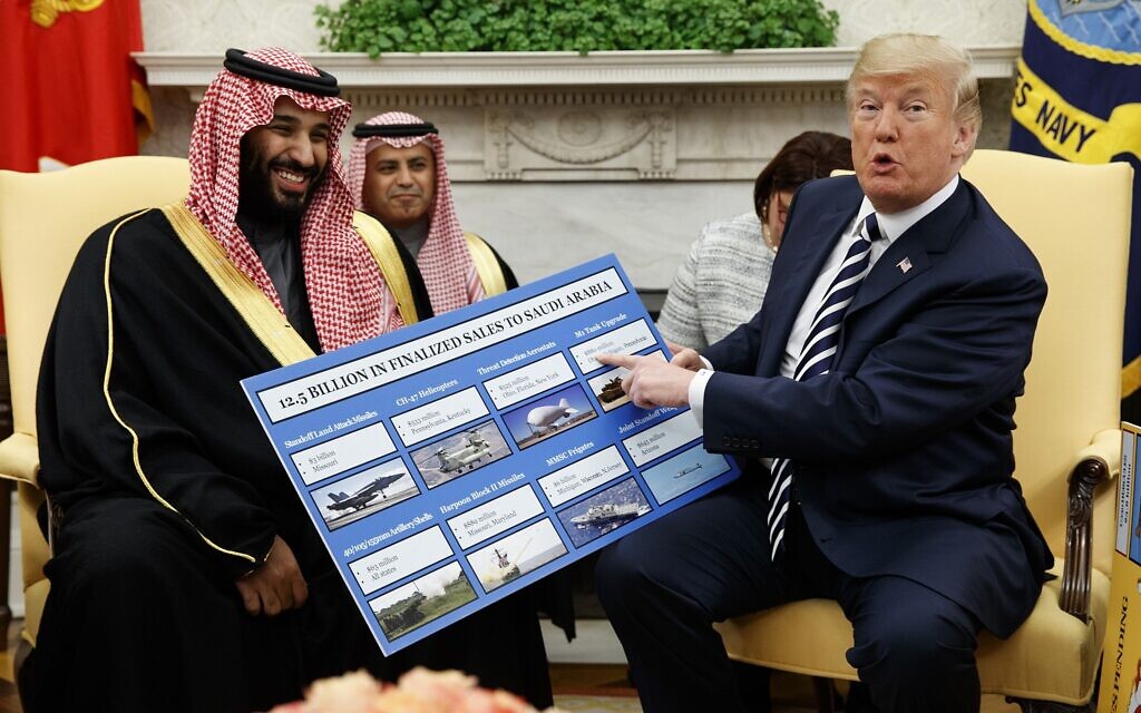 US President Donald Trump, right, shows a chart highlighting arms sales to Saudi Arabia during a meeting with Saudi Crown Prince Mohammed bin Salman in the Oval Office of the White House, in Washington, March 20, 2018. (AP Photo/Evan Vucci) US President Donald Trump, right, shows a chart highlighting arms sales to Saudi Arabia during a meeting with Saudi Crown Prince Mohammed bin Salman in the Oval Office of the White House, in Washington, March 20, 2018. (AP Photo/Evan Vucci)