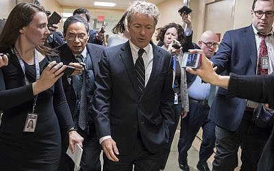 Sen. Rand Paul, walks to the Senate floor for a vote with accompanying reporters, on Capitol Hill in Washington on March 21, 2018.  (AP/J. Scott Applewhite)