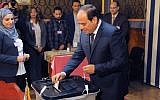 In this photo provided by Egypt's state news agency, MENA, Egyptian President Abdel-Fattah el-Sissi votes in Cairo, Egypt, March 27, 2018. (MENA via AP)