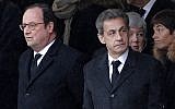 Former French Presidents Francois Hollande, left, and Nicolas Sarkozy wait prior to a national ceremony for Lt. Col. Arnaud Beltrame, Wednesday March 28, 2018 at the Hotel des Invalides in Paris. (AP Photo/Christophe Ena)