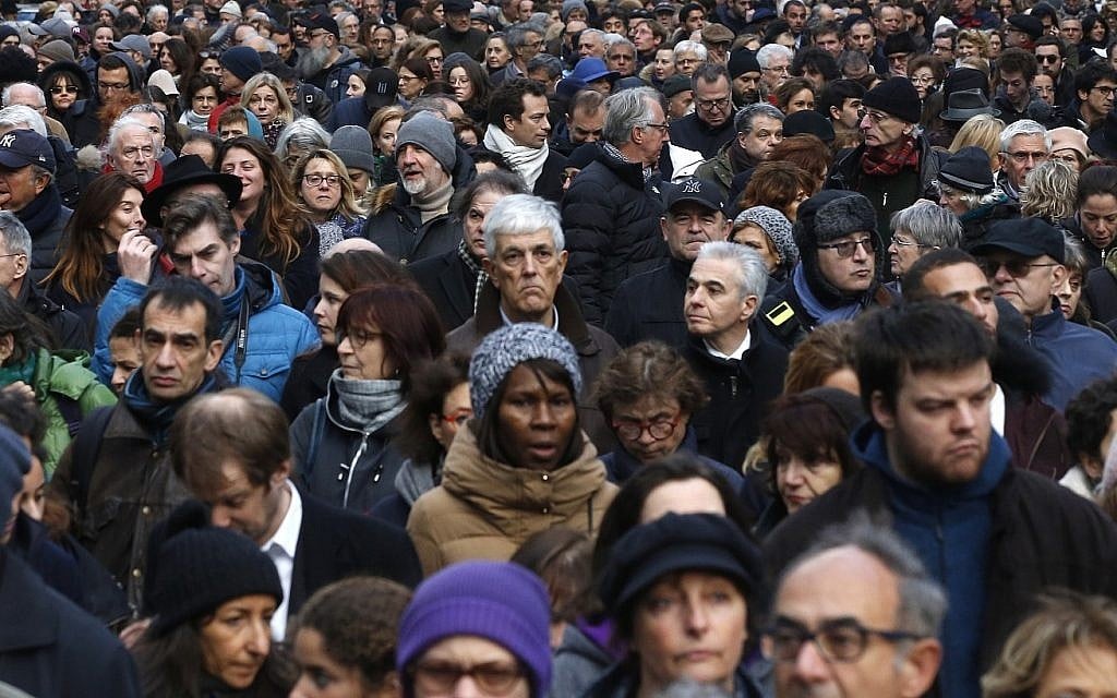 People attend a silent march to honor an 85-year-old woman who escaped the Nazis 76 years ago but was stabbed to death last week in her Paris apartment, apparently targeted because she was Jewish, and to denounce racism, in Paris, France, Wednesday, March 28, 2018. (AP Photo/Thibault Camus) People attend a silent march to honor an 85-year-old woman who escaped the Nazis 76 years ago but was stabbed to death last week in her Paris apartment, apparently targeted because she was Jewish, and to denounce racism, in Paris, France, Wednesday, March 28, 2018. (AP Photo/Thibault Camus)