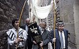 Illustrative: Members of the restored Synagogue of Barcelona carry a Torah to its new home in Barcelona, Spain, January 22, 2006. (AP Photo/Manu Fernandez)