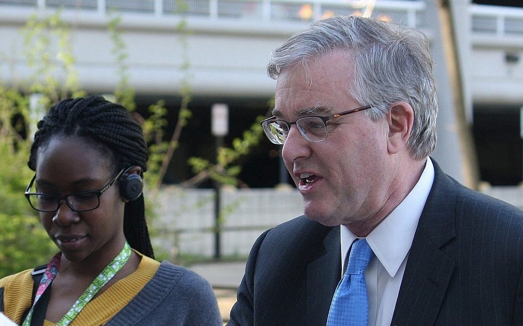 David Trone, right, owner of wine superstore chain Total Wine and More, greets commuters at the Shady Grove Metro station, in Derwood, Md., on Wednesday, April 20, 2016. (AP Photo/Brian Witte) David Trone, right, owner of wine superstore chain Total Wine and More, greets commuters at the Shady Grove Metro station, in Derwood, Md., on Wednesday, April 20, 2016. (AP Photo/Brian Witte)