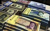 Iranian and US banknotes on display at a currency exchange shop in downtown Tehran, Iran, on April 4, 2015. (Vahid Salemi/AP)
