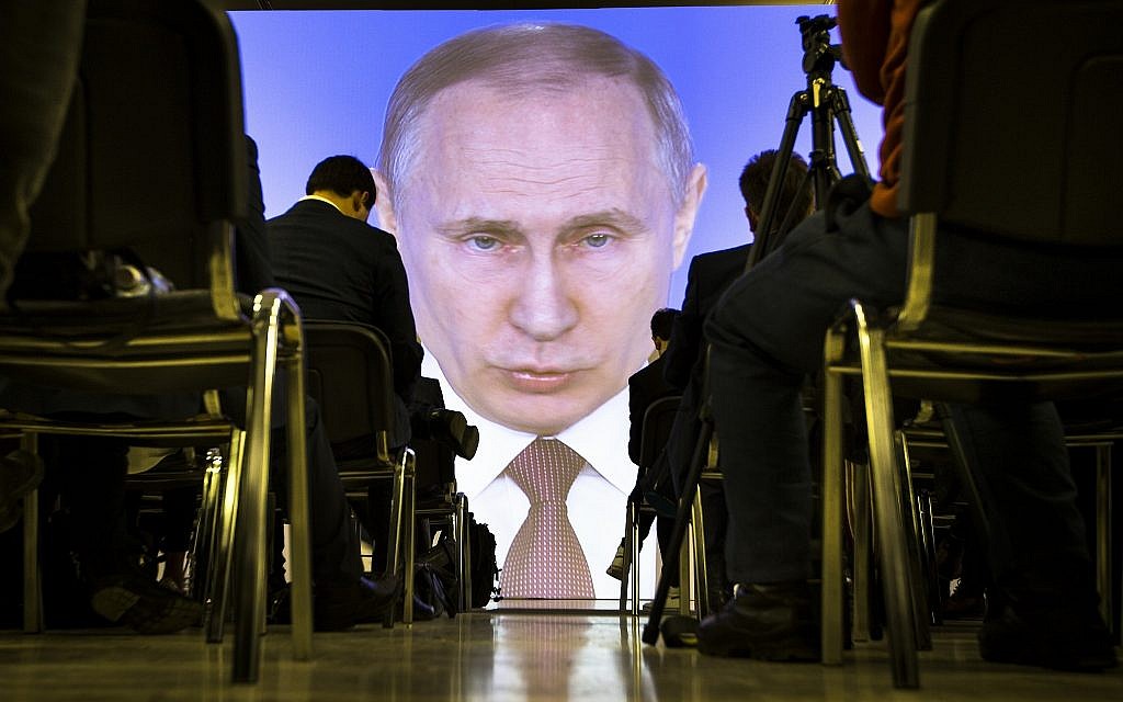Journalists watch as Russian President Vladimir Putin gives his annual state of the nation address in Manezh in Moscow, Russia, Thursday, March 1, 2018. (AP Photo/Alexander Zemlianichenko) Journalists watch as Russian President Vladimir Putin gives his annual state of the nation address in Manezh in Moscow, Russia, Thursday, March 1, 2018. (AP Photo/Alexander Zemlianichenko)