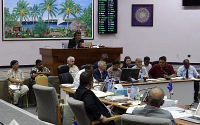 In this Feb. 23, 2018, photo, lawmakers listen to people discuss the pros and cons of creating a digital currency, in Majuro, Marshall Islands. The Marshall Islands is creating its own digital currency in order to raise some hard cash to pay bills and boost the economy. (AP Photo/Hilary Hosia)