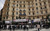 People hold banners of Egyptian presidential candidate Moussa Mustafa Moussa on a street in downtown Cairo, Egypt, Sunday, March 4, 2018. (AP Photo/Nariman El-Mofty)