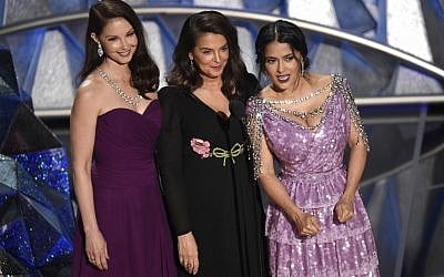 Ashley Judd, from left, Annabella Sciorra and Salma Hayek speak at the Oscars on Sunday, March 4, 2018, at the Dolby Theatre in Los Angeles. (Photo by Chris Pizzello/Invision/AP)