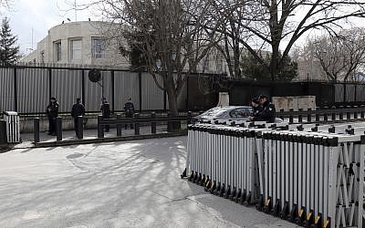 Turkish security members stand outside the US embassy in Ankara, Turkey, Monday, March 5, 2018. (AP Photo/Burhan Ozbilici)