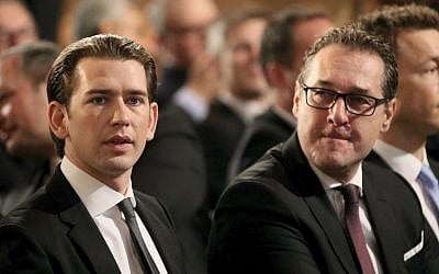 Austrian Chancellor Sebastian Kurz and Vice Chancellor Heinz-Christian Strache, from left, wait for the start of a commemoration on the occasion of the 80th anniversary of the connection to Hitler Germany, the so-called Anschluss, at the Hofburg palace in Vienna, Austria, Monday, March 12, 2018. (AP Photo/Ronald Zak)