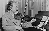 Albert Einstein is shown playing the violin, date and location unknown (AP Photo)