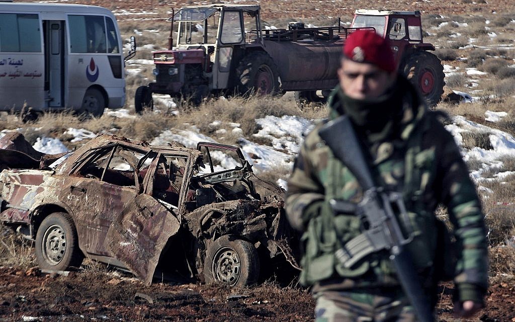 Illustrative: A Lebanese army soldier stands guard at the scene where a car bomb went off near a Hezbollah base near the village of Sbouba in the Baalbek region eastern Lebanon, early Tuesday, Dec. 17, 2013. (AP Photo/Bilal Hussein)