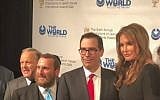 Former Olympic gold medalist Caitlyn Jenner (R) is honored as a 'great friend' to Israel at the annual World Values Network dinner, March 8, 2018. Also pictured, from left: Sean Spicer, Rabbi Shmuley Boteach, Steve Mnuchin. (Danielle Ziri/Times of Israel)