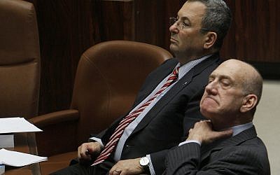Ehud Olmert, right, and Ehud Barak in the Knesset on March 30, 2009. Miriam Alster/Flash90)