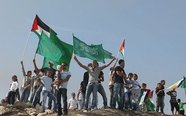 Palestinians wave Hamas flags as they celebrate the prisoner swap deal reached between Israel and Hamas in East Jerusalem. Oct 18, 2011.(Kobi Gideon / Flash90) Palestinians wave Hamas flags as they celebrate the prisoner swap deal reached between Israel and Hamas in East Jerusalem. Oct 18, 2011.(Kobi Gideon / Flash90)