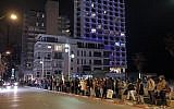 Illustrative: Protesters hold signs during a demonstration calling to end the war in Syria near the Russian Embassy in Tel Aviv on December 18, 2016.(Tomer Neuberg/Flash90)