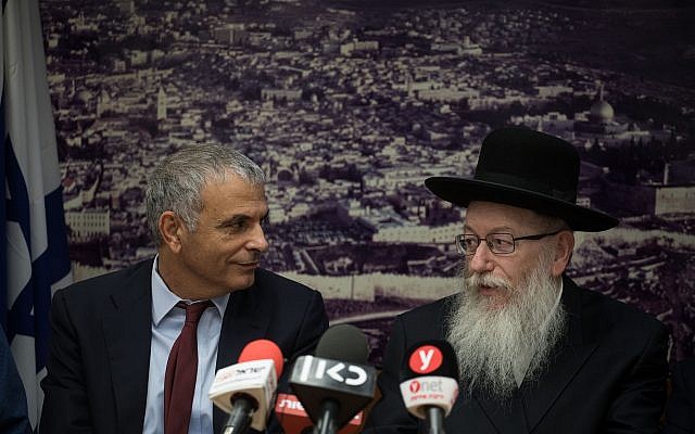 Finance Minister Moshe Kahlon, left, and Health Minister Yaakov Litzman at a press conference at the Finance Ministry in Jerusalem on November 20, 2017. (Hadas Parush/Flash90) Finance Minister Moshe Kahlon, left, and Health Minister Yaakov Litzman at a press conference at the Finance Ministry in Jerusalem on November 20, 2017. (Hadas Parush/Flash90)