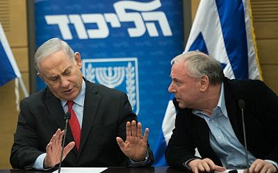 Prime Minister Benjamin Netanyahu with coalition chairman David Amsalem at a Likud party faction meeting at the Knesset on February 26, 2018. (Yonatan Sindel/Flash90)