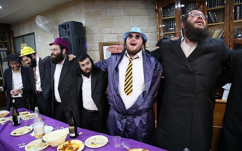 Ultra-Orthodox Jews dressed up in costumes celebrate the Jewish holiday of Purim in Meron on March 1, 2018. (David Cohen/Flash90)