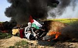 Palestinian protesters seen during clashes with Israeli soldiers near the Israel-Gaza border, east of Khan Younis in the southern Gaza Strip, March 2, 2018. (Abed Rahim Khatib/Flash90)