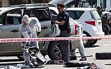 Israeli security forces at the scene of car-ramming attack near the train station in the northern city of Acre, on March 4, 2018. (Meir Vaknin/Flash90)