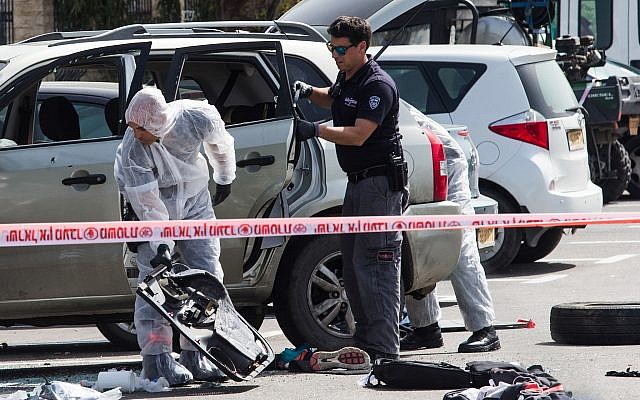 Israeli security forces at the scene of car-ramming attack near the train station in the northern city of Acre, on March 4, 2018. (Meir Vaknin/Flash90) Israeli security forces at the scene of car-ramming attack near the train station in the northern city of Acre, on March 4, 2018. (Meir Vaknin/Flash90)