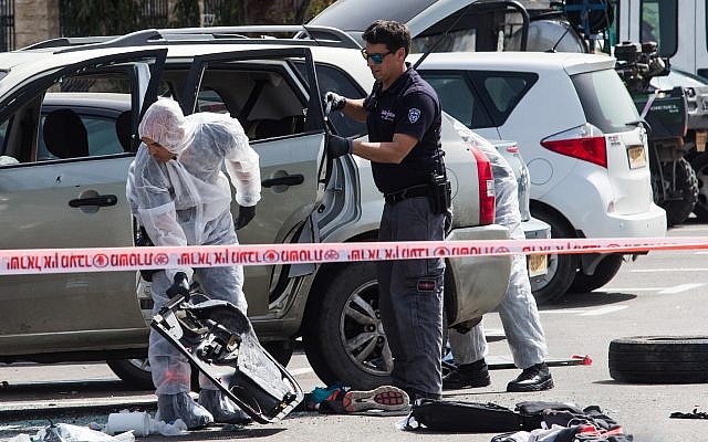 Police at the scene of a suspected ramming attack in the northern city of Acre on March 4, 2018. (Meir Vaknin/Flash90) Police at the scene of a suspected ramming attack in the northern city of Acre on March 4, 2018. (Meir Vaknin/Flash90)