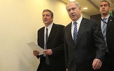 Prime Minister Benjamin Netanyahu, center, and Nir Hefetz, left, arrive at the weekly cabinet meeting held in the Prime Minister's Office in Jerusalem, December 13, 2009. (Yossi Zamir/Flash90)