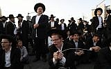 Ultra orthodox Jewish men protest against the army draft, at the entrance to Jerusalem on March 8, 2018. (Yonatan Sindel/Flash90)