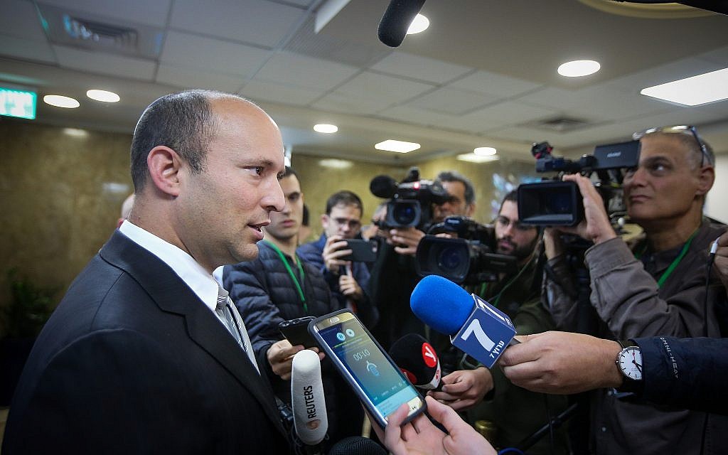 Education Minister Naftali Bennett (L) speaks to reporters as he arrives to the weekly cabinet meeting at the Prime Minister's Office in Jerusalem on March 11, 2018. (Marc Israel Sellem/Pool)