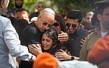 Family members of Cpt. Ziv Daos mourn near his coffin during his funeral in Holon on March 18, 2018. (Miriam Alster/Flash90)