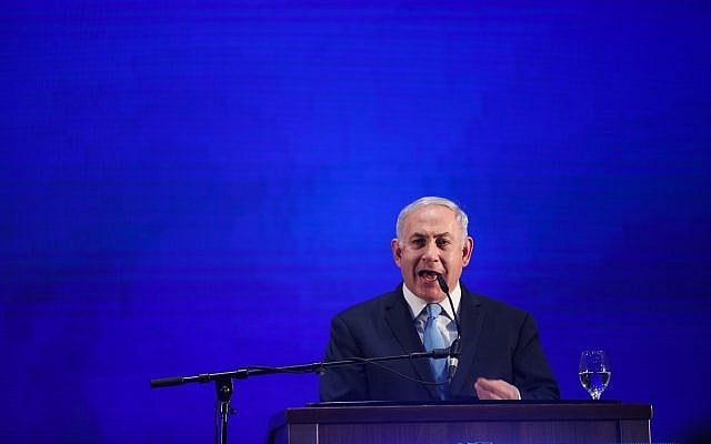 Prime Minister Benjamin Netanyahu addresses a gathering of Likud party activists in Tel Aviv ahead of the Passover holiday on March 22, 2018. (Hadas Parush/Flash90)