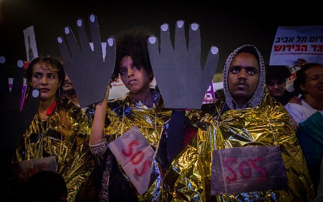 African asylum seekers and human rights activists protest against deportation of asylum seekers at Rabin Square in Tel Aviv on March 24, 2018. (Miriam Alster/Flash90) African asylum seekers and human rights activists protest against deportation of asylum seekers at Rabin Square in Tel Aviv on March 24, 2018. (Miriam Alster/Flash90)
