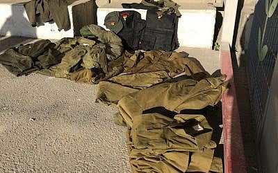 IDF uniforms caught at the Kerem Shalom border crossing as they were being smuggled into Gaza. (Defense Ministry)