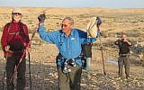Trip leader Shuka Revak, 86, fulfills a life-long dream as he reaches Avdat in Israel from Jordan's Petra, February 2018. (courtesy)
