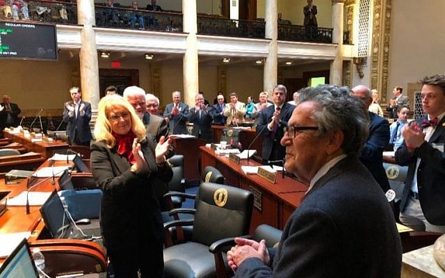Holocaust survivor Fred Gross receives a standing ovation from the Kentucky Senate moments after the lawmakers voted unanimously to pass a Holocaust education bill that bears his name, March 21, 2018. (Lee Chottiner via JTA) Holocaust survivor Fred Gross receives a standing ovation from the Kentucky Senate moments after the lawmakers voted unanimously to pass a Holocaust education bill that bears his name, March 21, 2018. (Lee Chottiner via JTA)