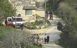 Video from Yesh Din shows a stun grenade thrown by Border Police officers exploding next to a Palestinian couple carrying a baby in the northern West Bank village of Burin on March 2, 2018. (Screen capture: Facebook)