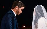 Noam Oren (L) and his wife on their wedding day on August 16, 2016. (Yarin Taranos/courtesy)